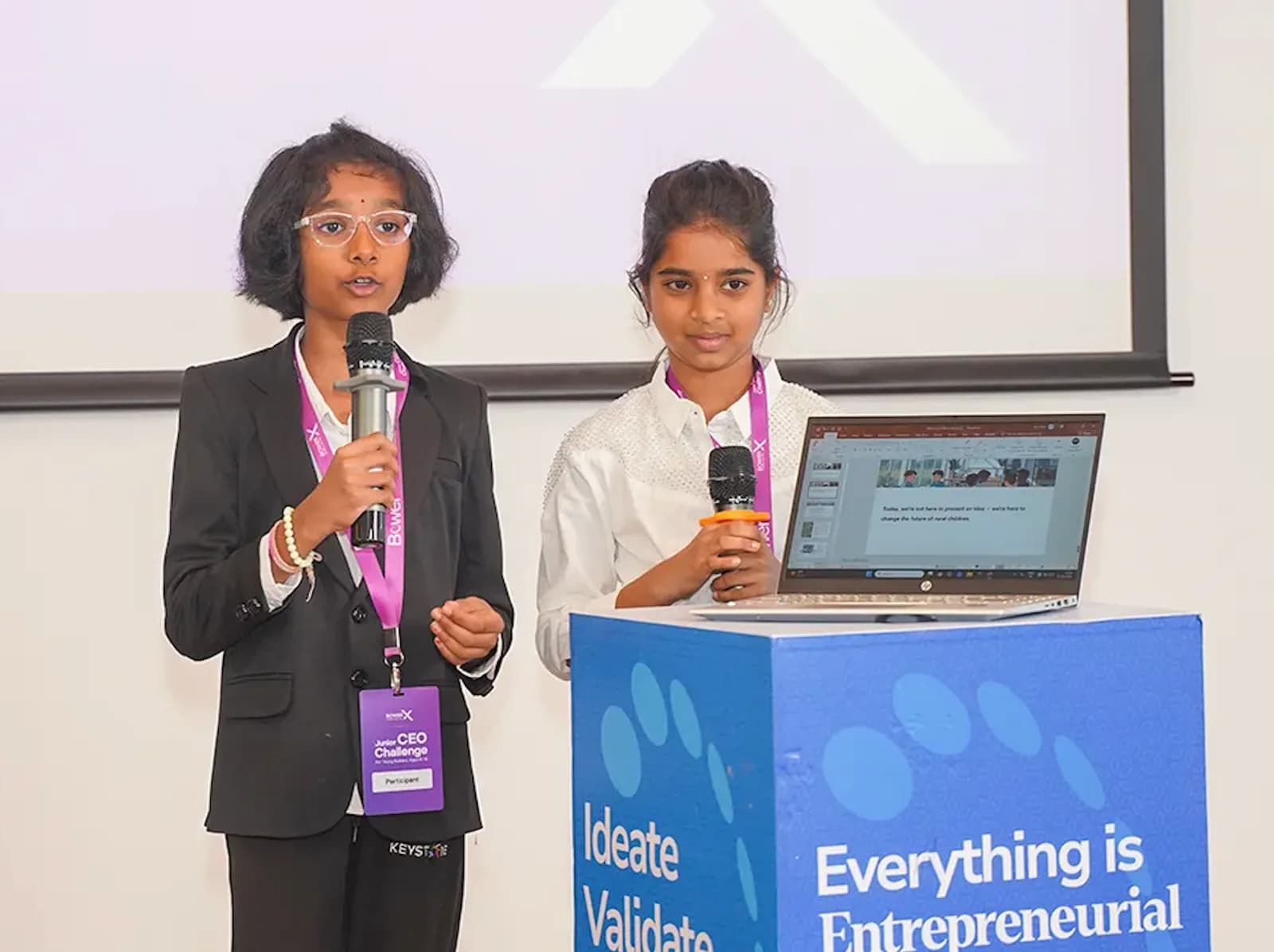 Bower X students presenting on the podium