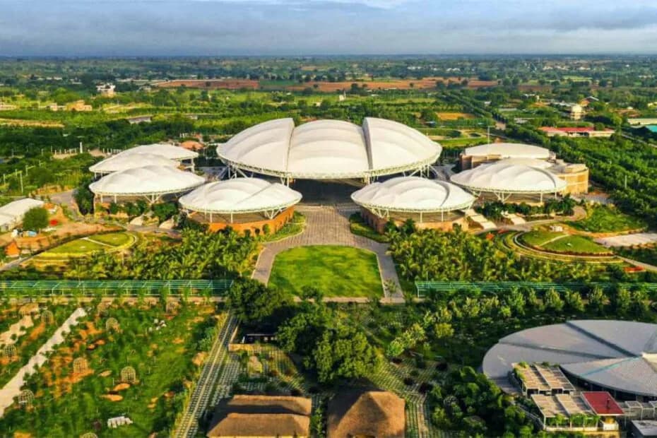 Aerial view of Kanha Shanti Vanam, with its white canopy meditation halls set among gardens