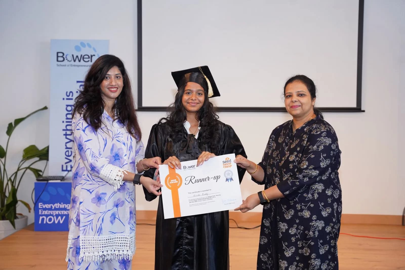 A SEED student receiving her certificate at the showcase