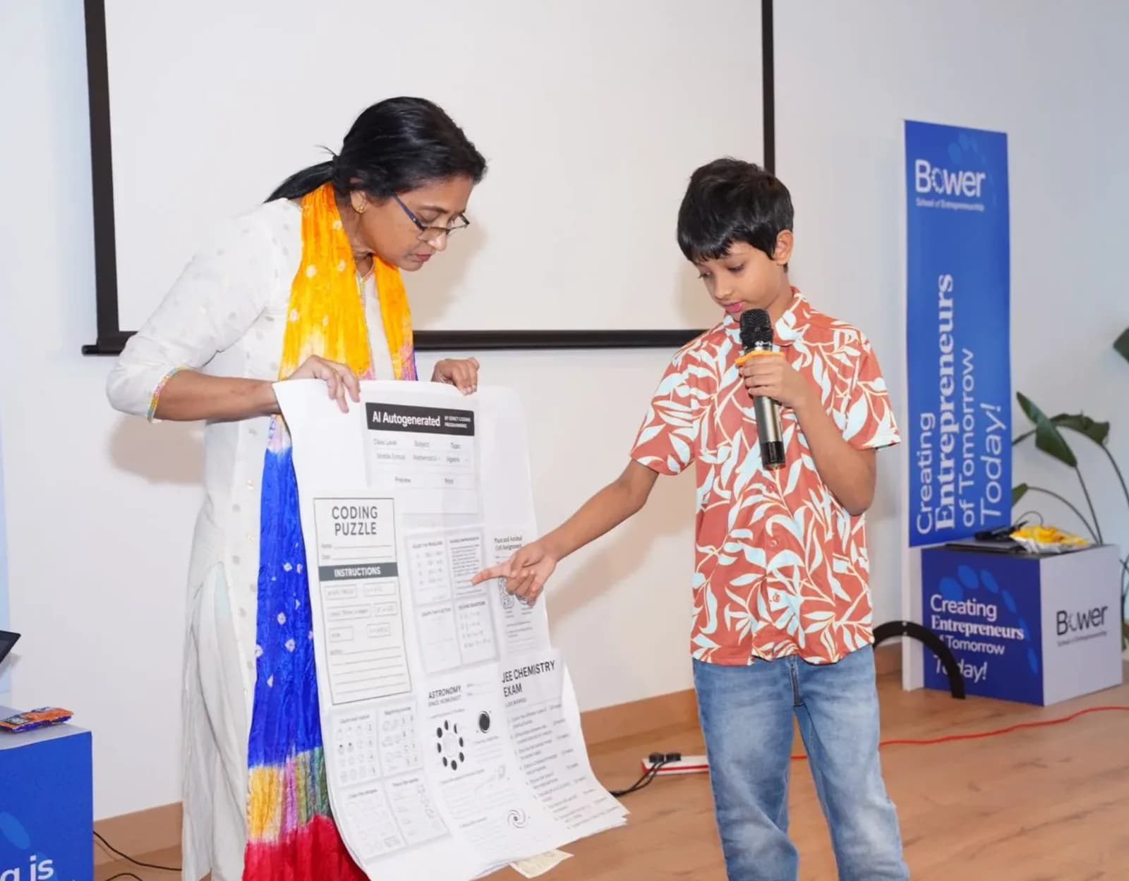 A SEED student presenting his AI coding project to a mentor